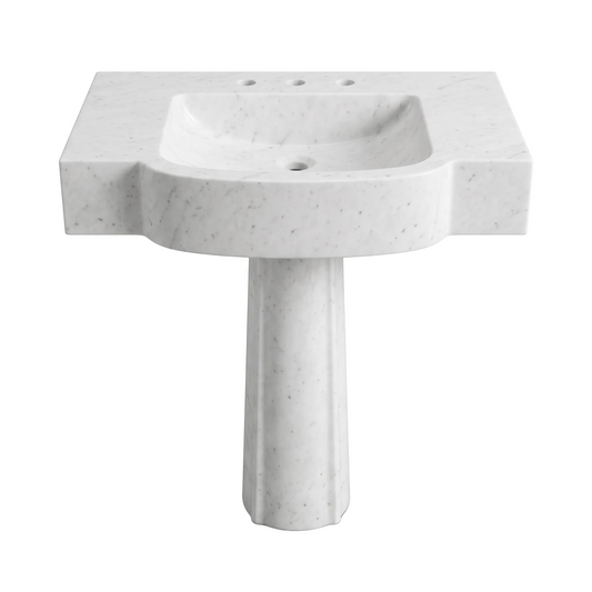 Velmora custom Carrara White marble pedestal bathroom sink with thick sculpted curved front, rectangular integrated basin, three faucet holes and carved pedestal base